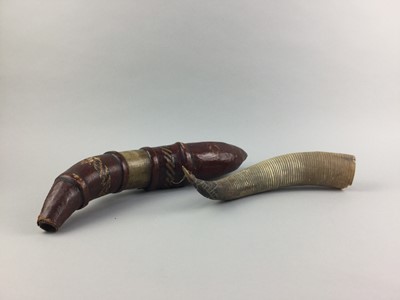 Lot 17 - AN AFRICAN LEATHER COVERED POWDER HORN