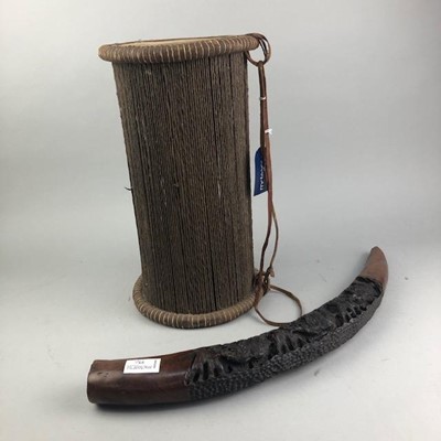 Lot 77 - AN AFRICAN HARDWOOD CARVING ALONG WITH A DRUM