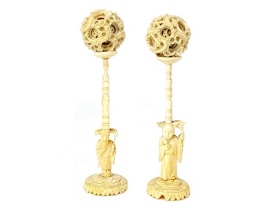 Lot 791 - A LOT OF TWO EARLY 20TH CENTURY CHINESE IVORY CONCENTRIC BALLS ON STANDS
