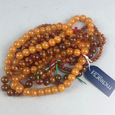 Lot 145 - SIX AMBER COLOURED BEAD NECKLACES