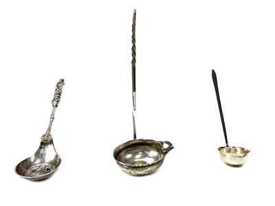 Lot 519 - A CONTINENTAL SILVER APOSTLE SPOON ALONG WITH TWO TODDY LADLES