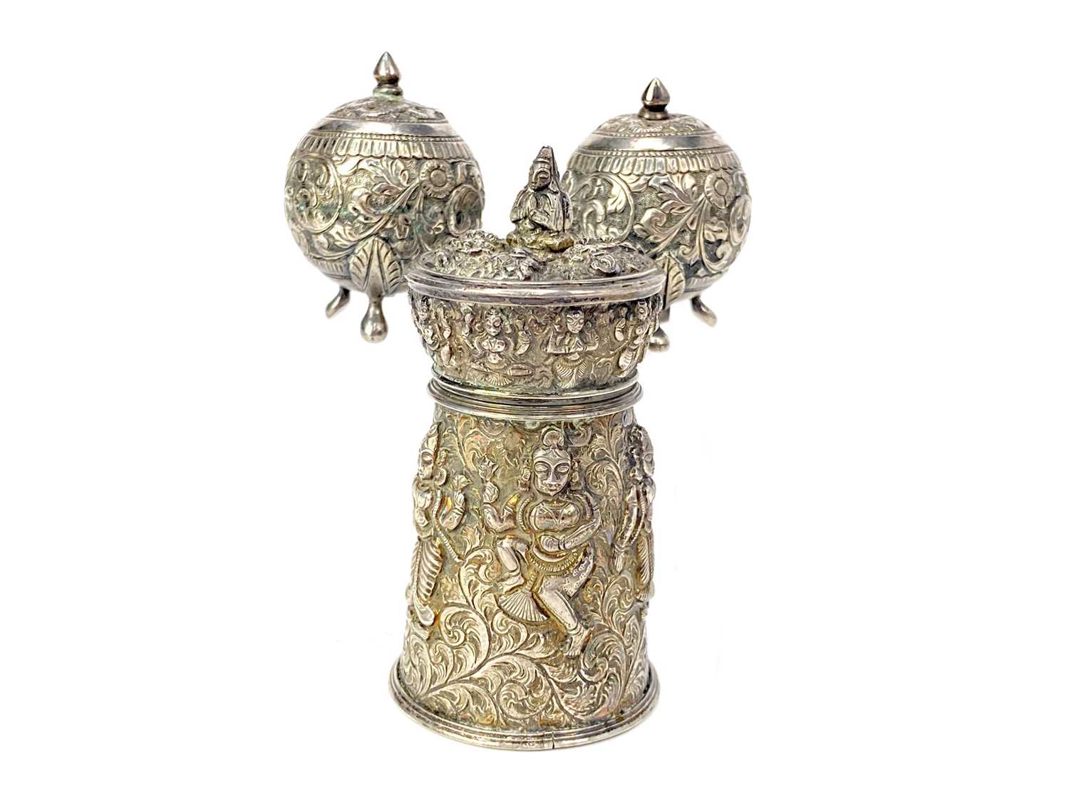 Lot 702 - AN INDIAN WHITE METAL PEPPER GRINDER AND A PAIR OF METAL CONDIMENT CASTERS