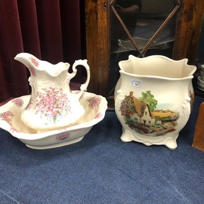 Lot 587 - A DECORATIVE EWER AND BASIN AND A CERAMIC PLANTER