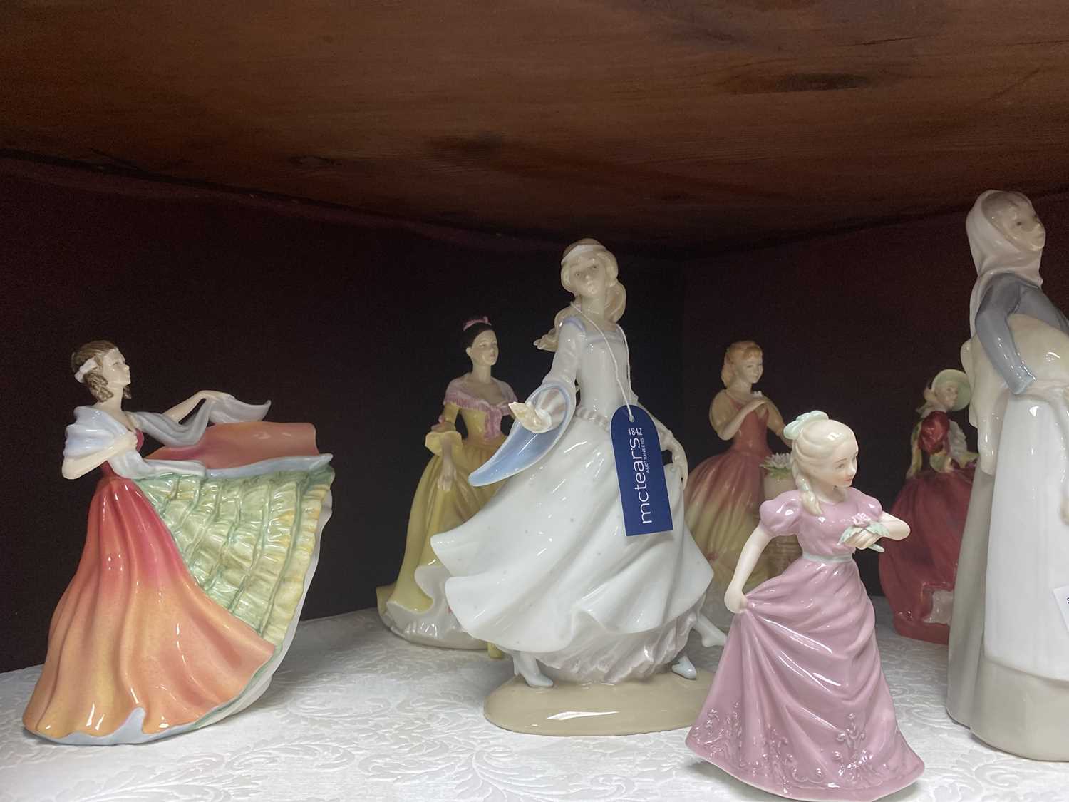 Lot 210 - A ROYAL DOULTON FIGURE OF 'WELSH BEAUTY' AND SIX OTHER FIGURES