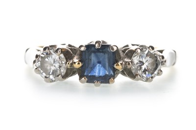 Lot 1401 - A BLUE GEM SET AND MOISSANITE THREE STONE RING