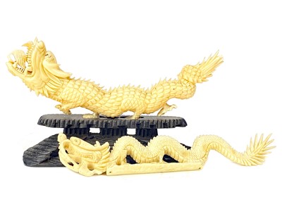 Lot 832 - A LOT OF TWO EARLY 20TH CENTURY CHINESE IVORY CARVINGS OF A DRAGONS