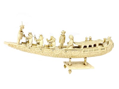 Lot 833 - AN EARLY 20TH CENTURY INDIAN IVORY CARVING OF A BOAT