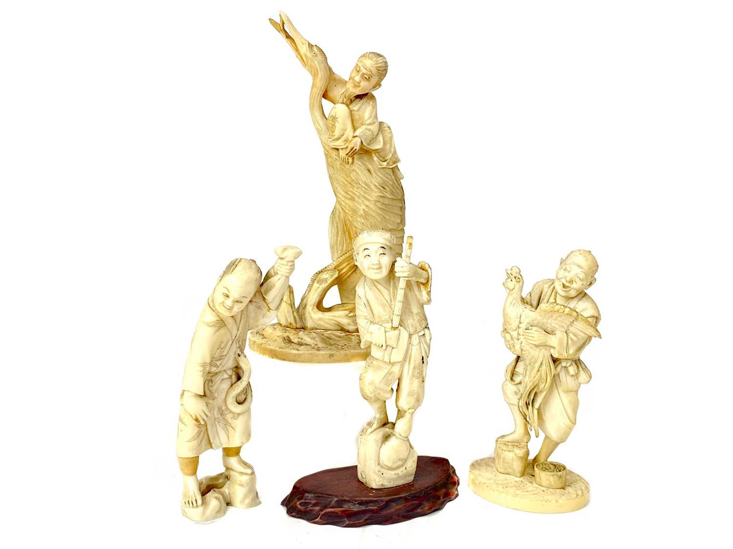 Lot 836 A LOT OF FOUR JAPANESE IVORY CARVINGS