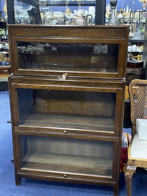 Lot 53 - AN OAK THREE SECTION BOOKCASE