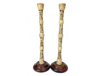 Lot 755 - A PAIR OF EARLY 20TH CENTURY JAPANESE IVORY CANDLESTICKS