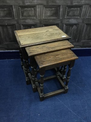 Lot 234 - AN OAK NEST OF THREE TABLES