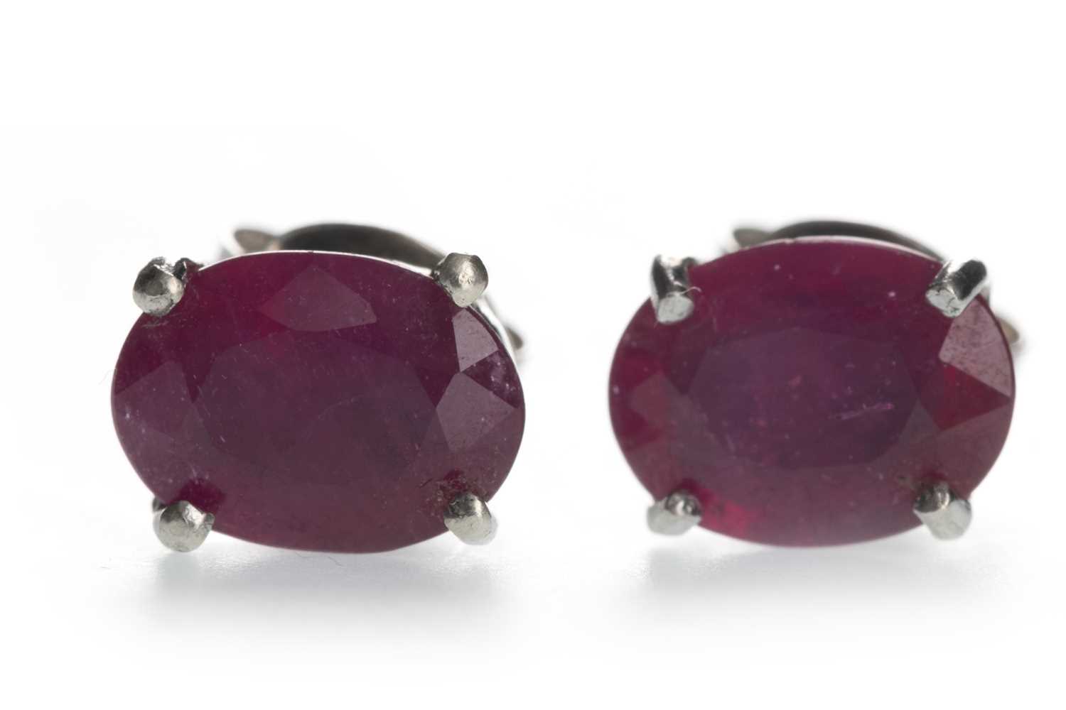 Lot 1417 - A PAIR OF TREATED RUBY STUD EARRINGS