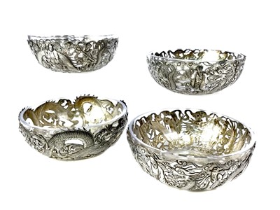 Lot 843 - A MATCHED SET OF FOUR CHINESE SILVER DISHES