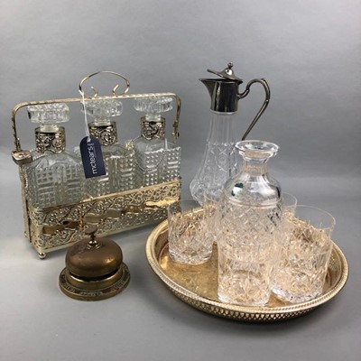 Lot 128 - A SILVER PLATED THREE DECANTER TANTALUS ALONG WITH OTHER PLATED AND GLASS WARE