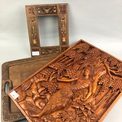 Lot 289 - AN ASIAN CARVED WOOD PANEL ALONG WITH A TRAY AND A FRAME