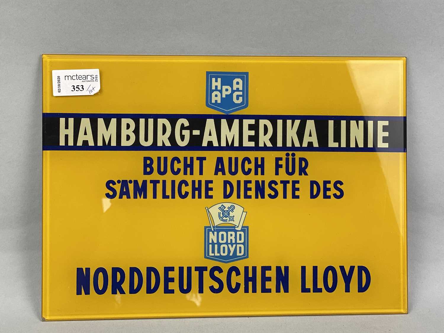 Lot 353 - A HAMBURG-AMERIKA LINIE GLASS SIGN, ANOTHER SIGN AND VARIOUS POSTCARDS