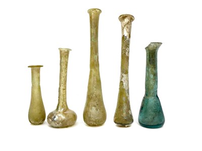 Lot 1123 - A LOT OF THREE ROMAN GLASS PERFUME BOTTLES AND TWO OTHERS