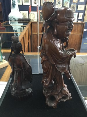 Lot 877 - A LOT OF TWO CHINESE CARVED WOOD FIGURES