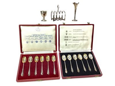 Lot 545 - A LOT OF TWO TWO CASED SETS OF SILVER TEASPOONS ALONG WITH A TOAST RACK, EGG CUP AND VASE