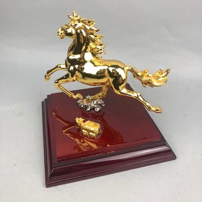 Lot 343 - A 20TH CENTURY MALAYSIAN GILT SCULPTURE OF A GALLOPING HORSE