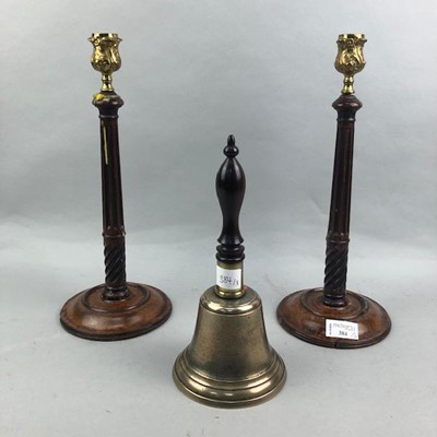 Lot 384 - A PAIR OF MAHOGANY CANDLESTICKS AND A VINTAGE SCHOOL BELL