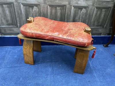 Lot 464 - A 20TH CENTURY CAMEL STOOL