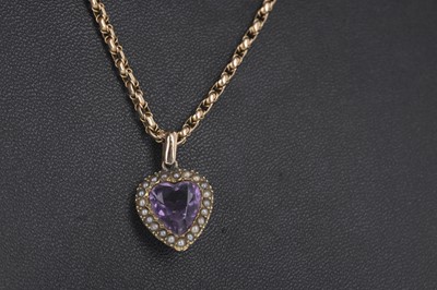 Lot 307 - A PURPLE GEM SET AND SEED PEARL PENDANT ON CHAIN