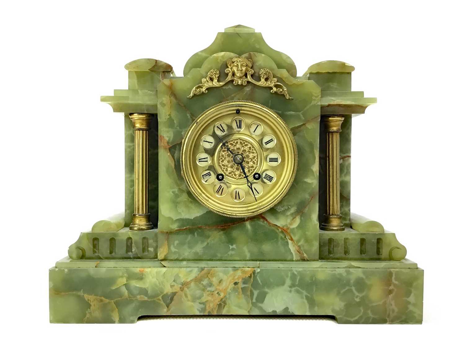 Lot 1120 - A LATE VICTORIAN GILT AND ONYX MANTEL CLOCK