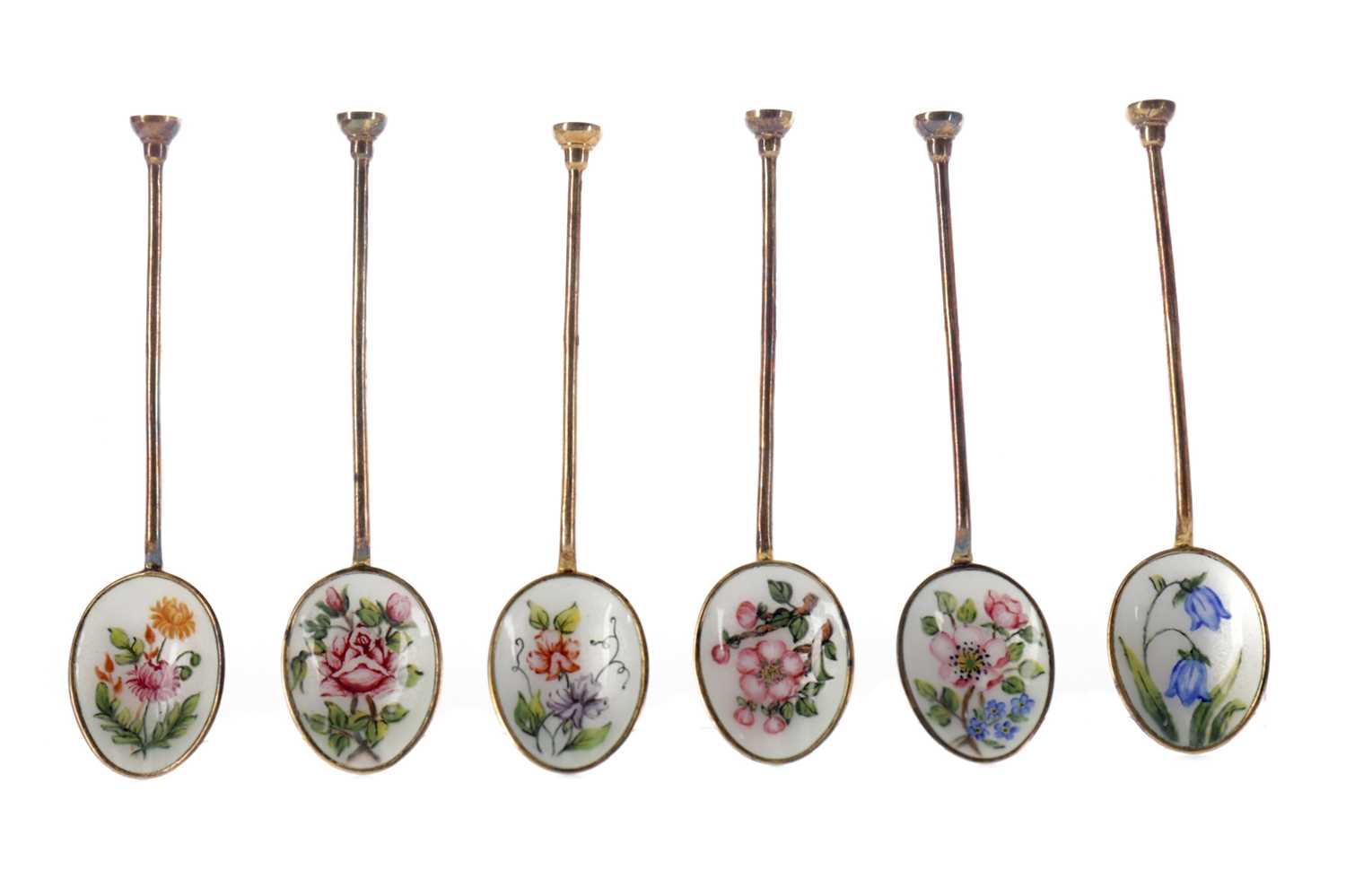 Lot 418 - A SET OF SIX SILVER GILT AND ENAMEL COFFEE SPOONS