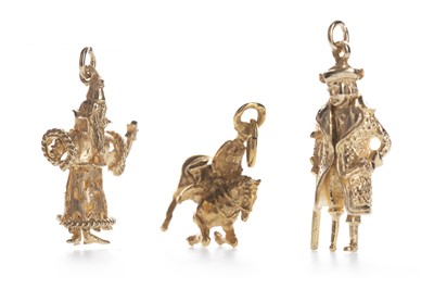 Lot 399 - THREE GOLD CHARMS
