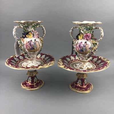 Lot 117 - A PAIR OF 19TH CENTURY FLOWER ENCRUSTED VASES AND COMPORTS