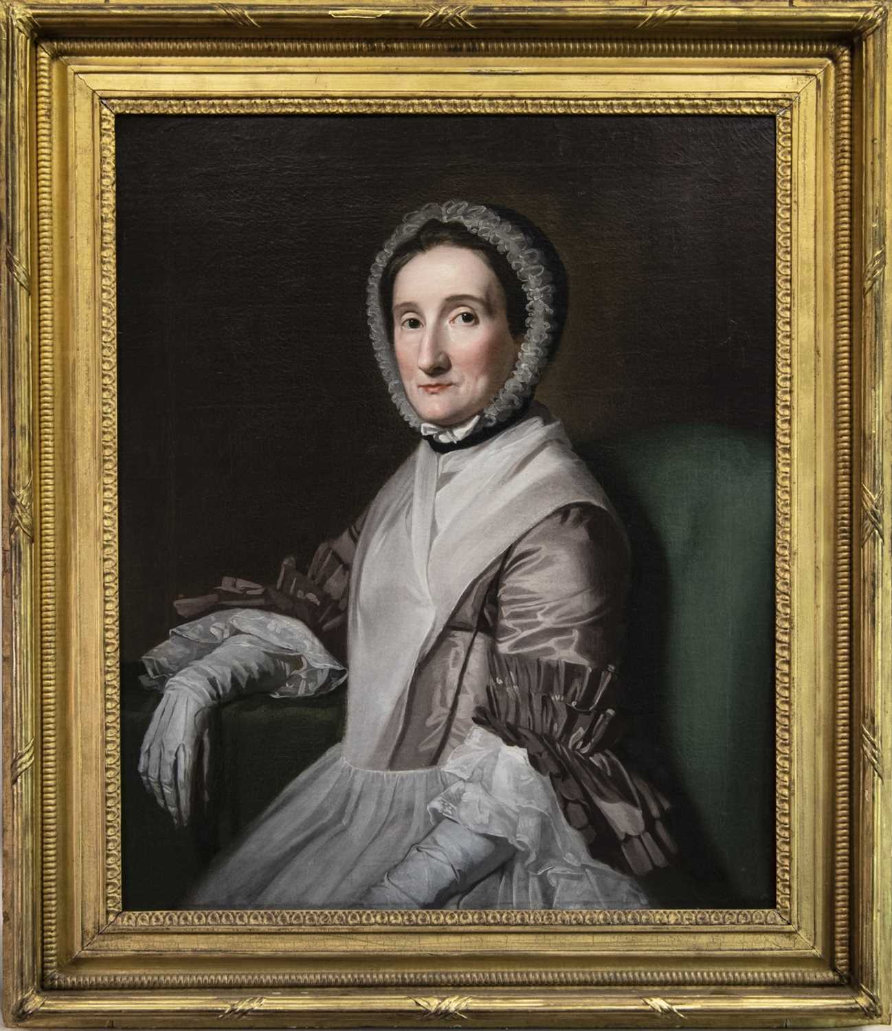Lot 81 - PORTRAIT OF A LADY SEATED IN A GREEN CHAIR, AN OIL
