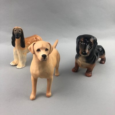 Lot 24 - A BESWICK FIGURE OF A DACHSHUND AND TWO OTHER DOGS