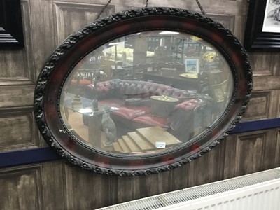 Lot 390 - A 20TH CENTURY STAINED WOOD OVAL WALL MIRROR