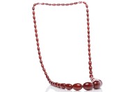 Lot 15 - CHERRY RED BAKELITE BEAD NECKLACE formed by...