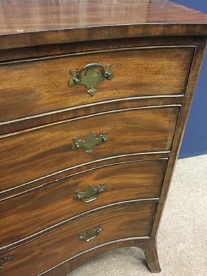 Lot 1357 - A MAHOGANY SERPENTINE CHEST OF DRAWERS