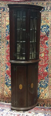 Lot 1356 - A MAHOGANY TWO STAGE BOW FRONT CORNER CUPBOARD