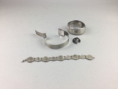 Lot 164 - A LOT OF THREE SILVER BANGLES AND A THAI PENDANT