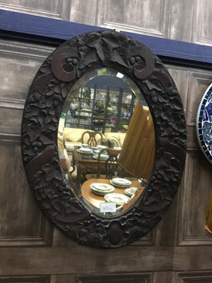 Lot 495 - A 20TH CENTURY OVAL WALL MIRROR AND A MODERN CERAMIC WALL MIRROR
