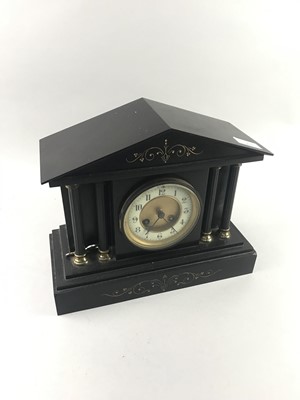 Lot 470 - A BLACK SLATE MANTEL CLOCK