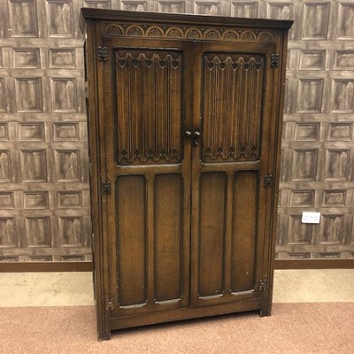 Lot 730A - AN OAK HALL WARDROBE