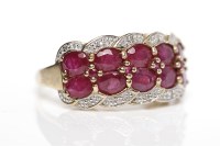 Lot 59 - RUBY AND DIAMOND DRESS RING set with a two...