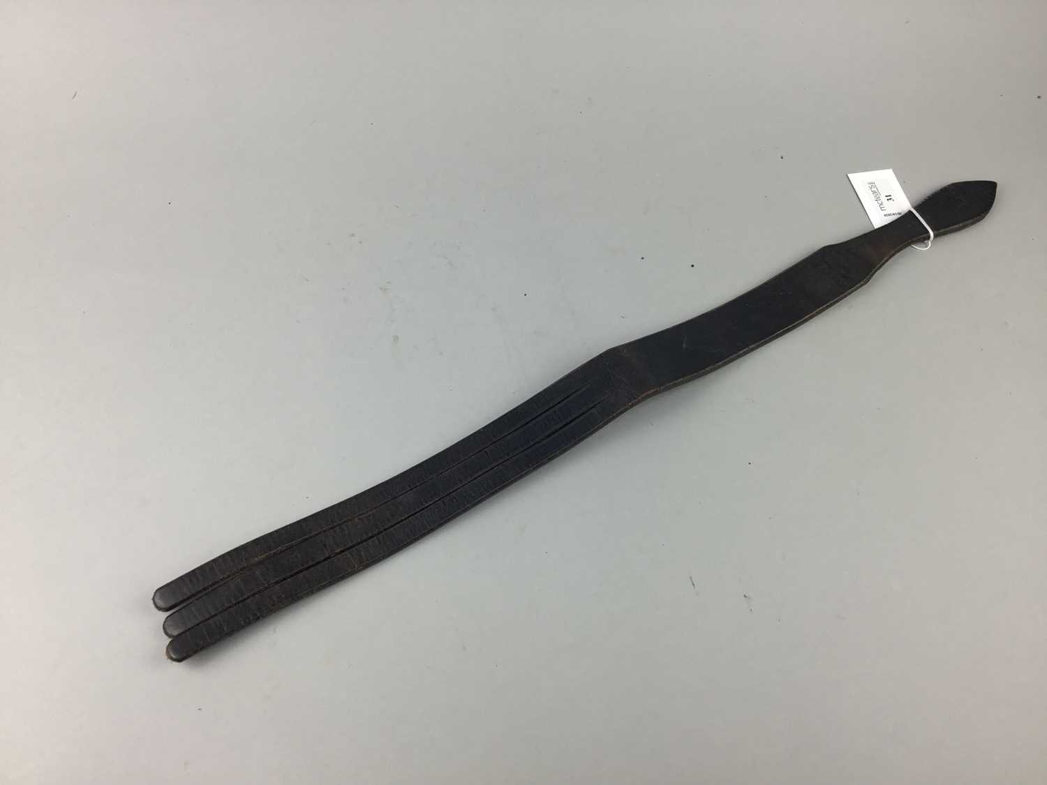 Lot 31 - A VINTAGE LEATHER THREE TAIL TAWSE