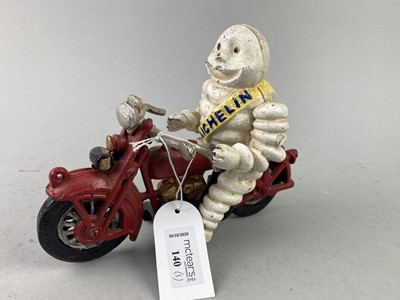 Lot 140 - A CAST METAL MICHELIN MAN AND OTHERS