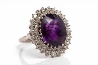 Lot 79 - AMETHYST AND DIAMOND CLUSTER RING with a large...