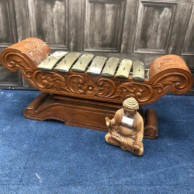 Lot 822 - A CARVED WOOD GONG AND A BUDDHA