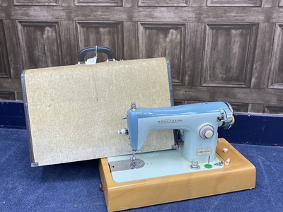 Lot 34 - A LOT OF TWO CASED SEWING MACHINES