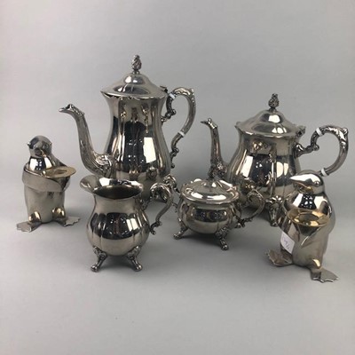 Lot 279 - A SILVER PLATED FOUR PIECE TEA SERVICE AND TWO CANDLE HOLDERS