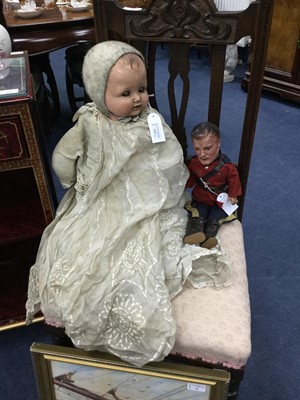 Lot 323 - A 20TH CENTURY DOLL AND ANOTHER DOLL DRESSED AS A SOLDIER