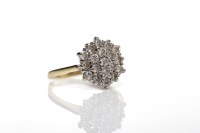 Lot 101 - DIAMOND CLUSTER RING set with round diamonds...